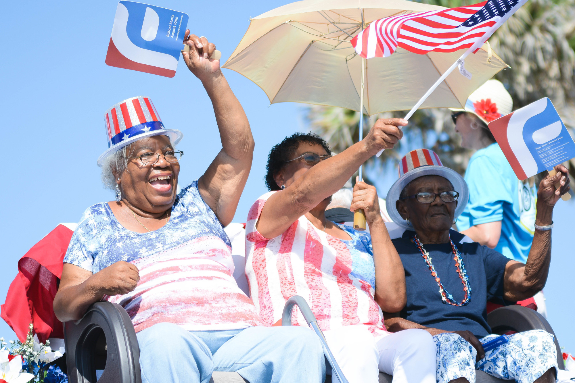 Ossie Cassell, Ida Jordan and their mother Luella Johnson sit on a history of Flagler County float during the 2017 Fourth of July parade in Flagler Beach. Photo by Paige Wilson