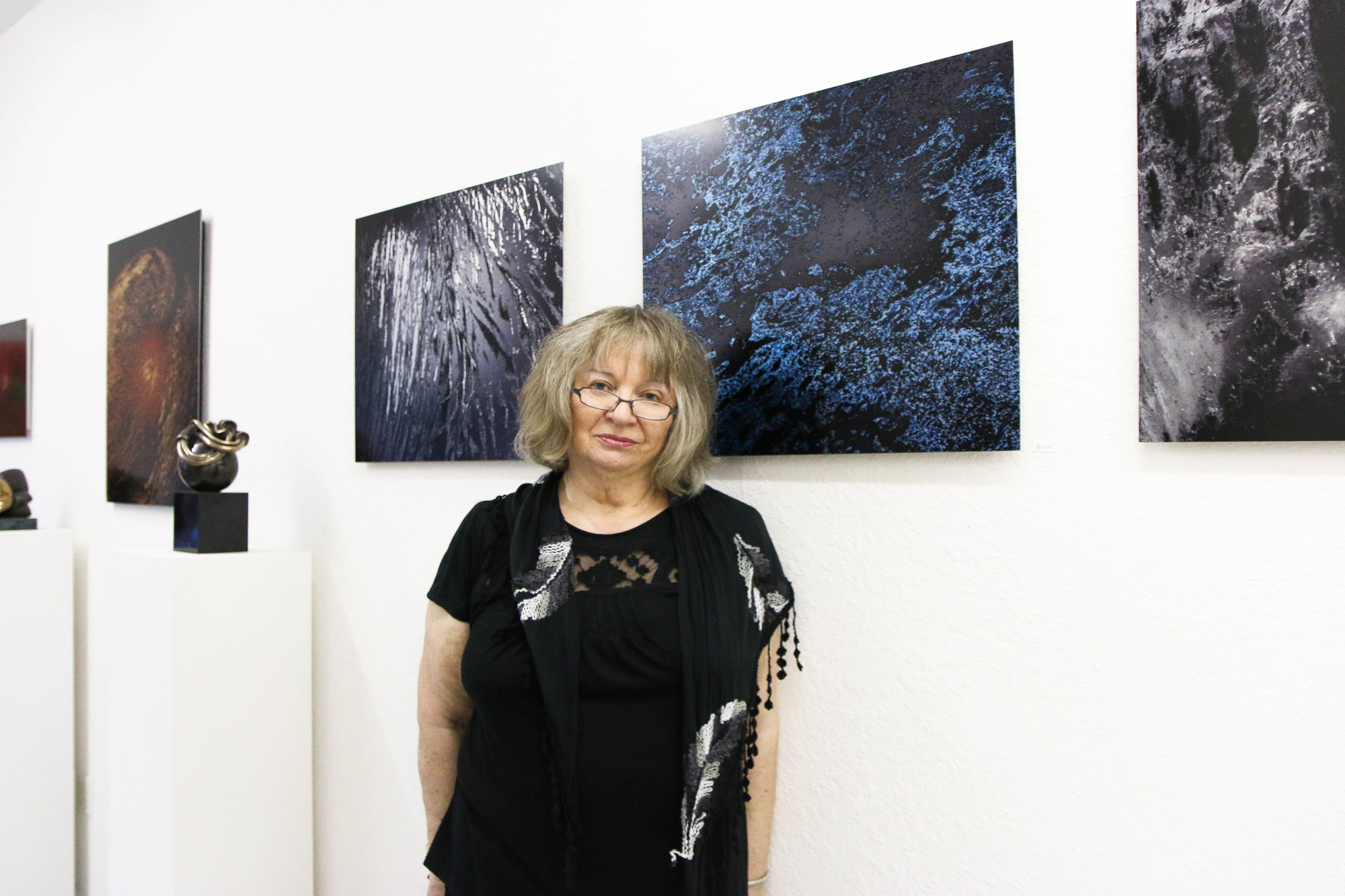 Artist Krystyna Spisak-Madejczyk poses in front of 