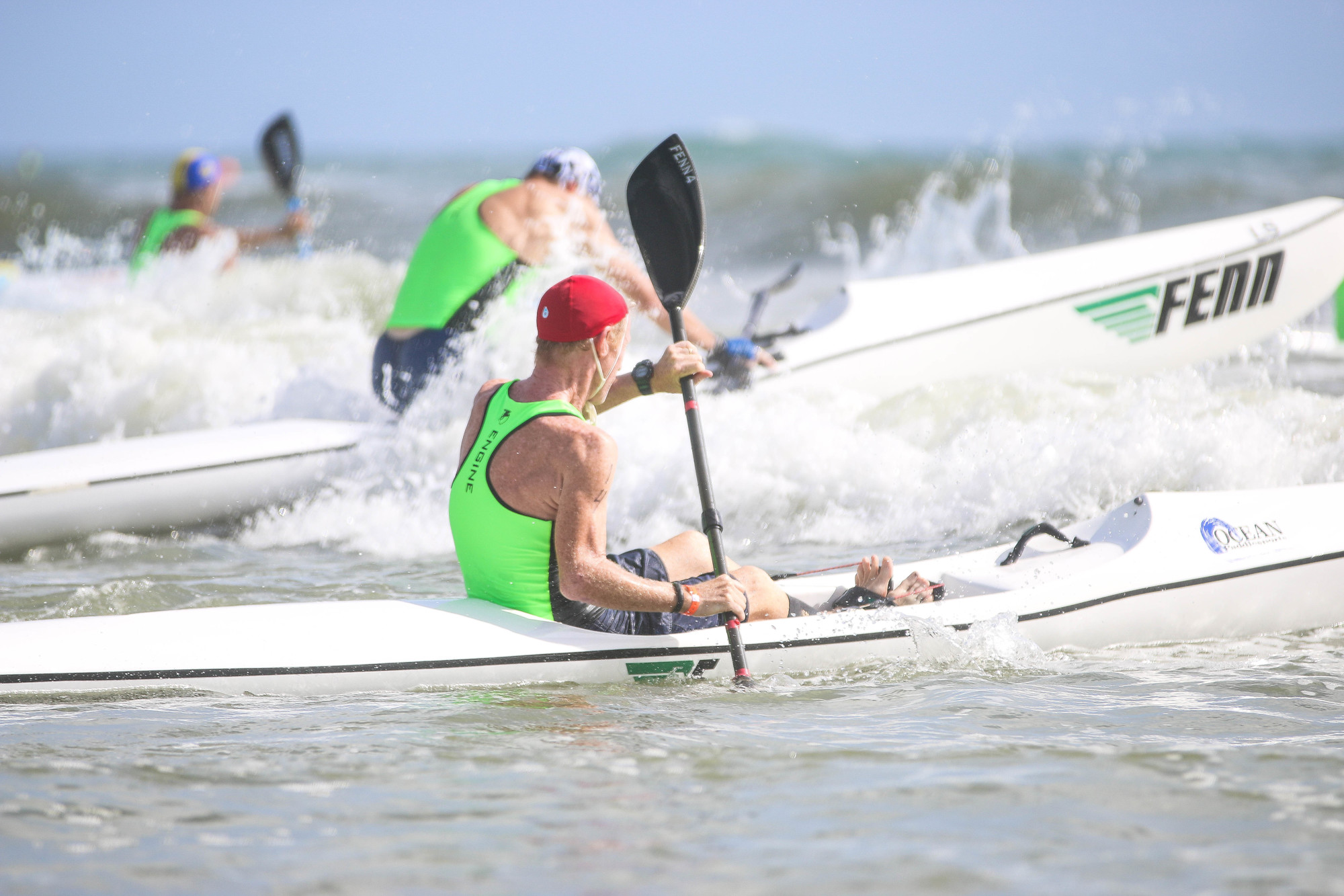 Tom Gillin competes in the surf ski race. Photo by Paige Wilson