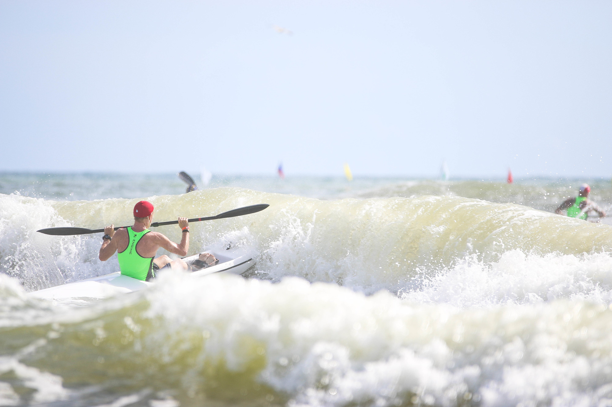 Tom Gillin competes in the surf ski race. Photo by Paige Wilson