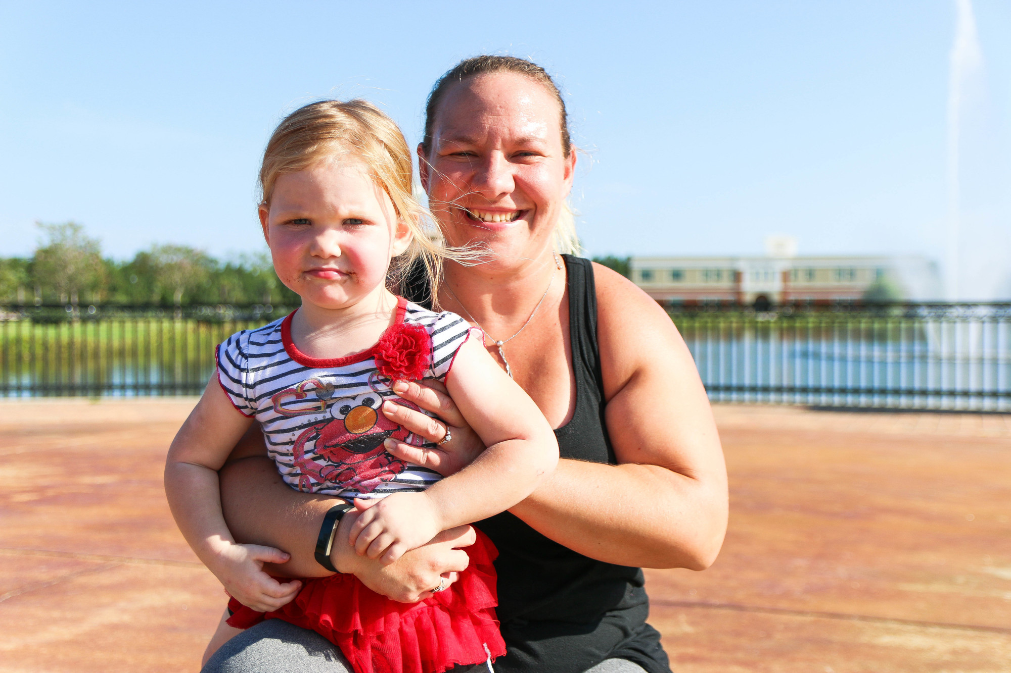 Fit Camp instructor Amanda Greenslade poses with her 3-year-old daughter, Emma. Photo by Paige Wilson