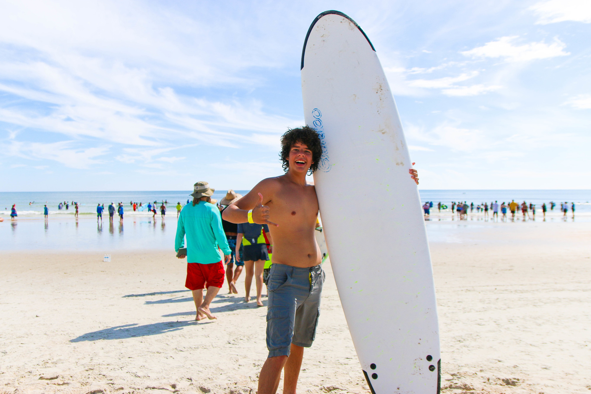 Bunnell resident Sean McKenney, 16, poses with a surfboard after his catches some waves. Photo by Paige Wilson
