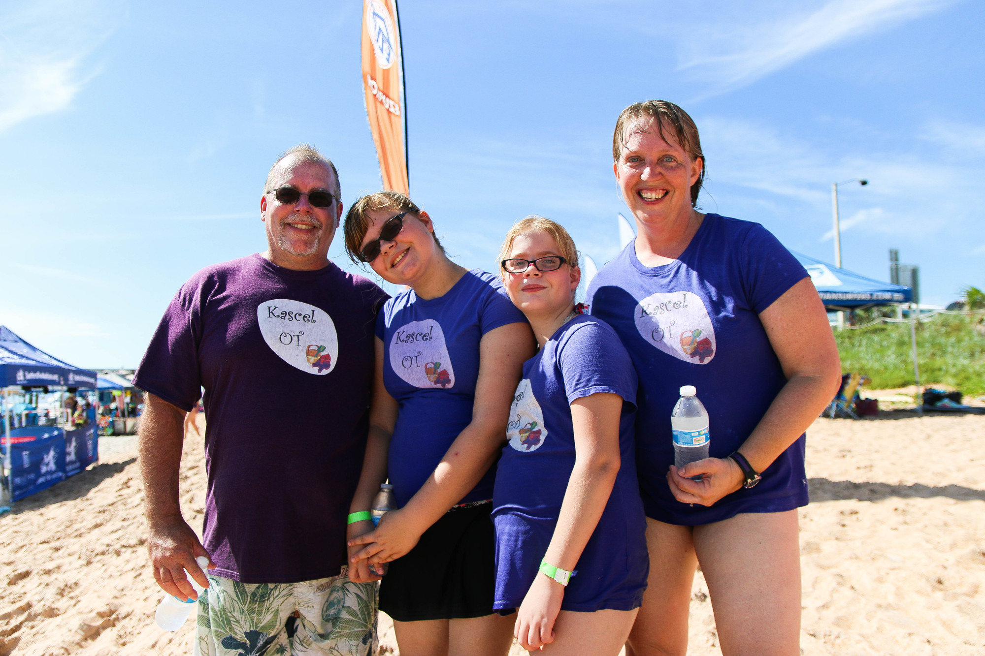 Kevin, Celeste, Kassandra and Jennifer Baker volunteer at the Surfers for Autism event. Photo by Paige Wilson
