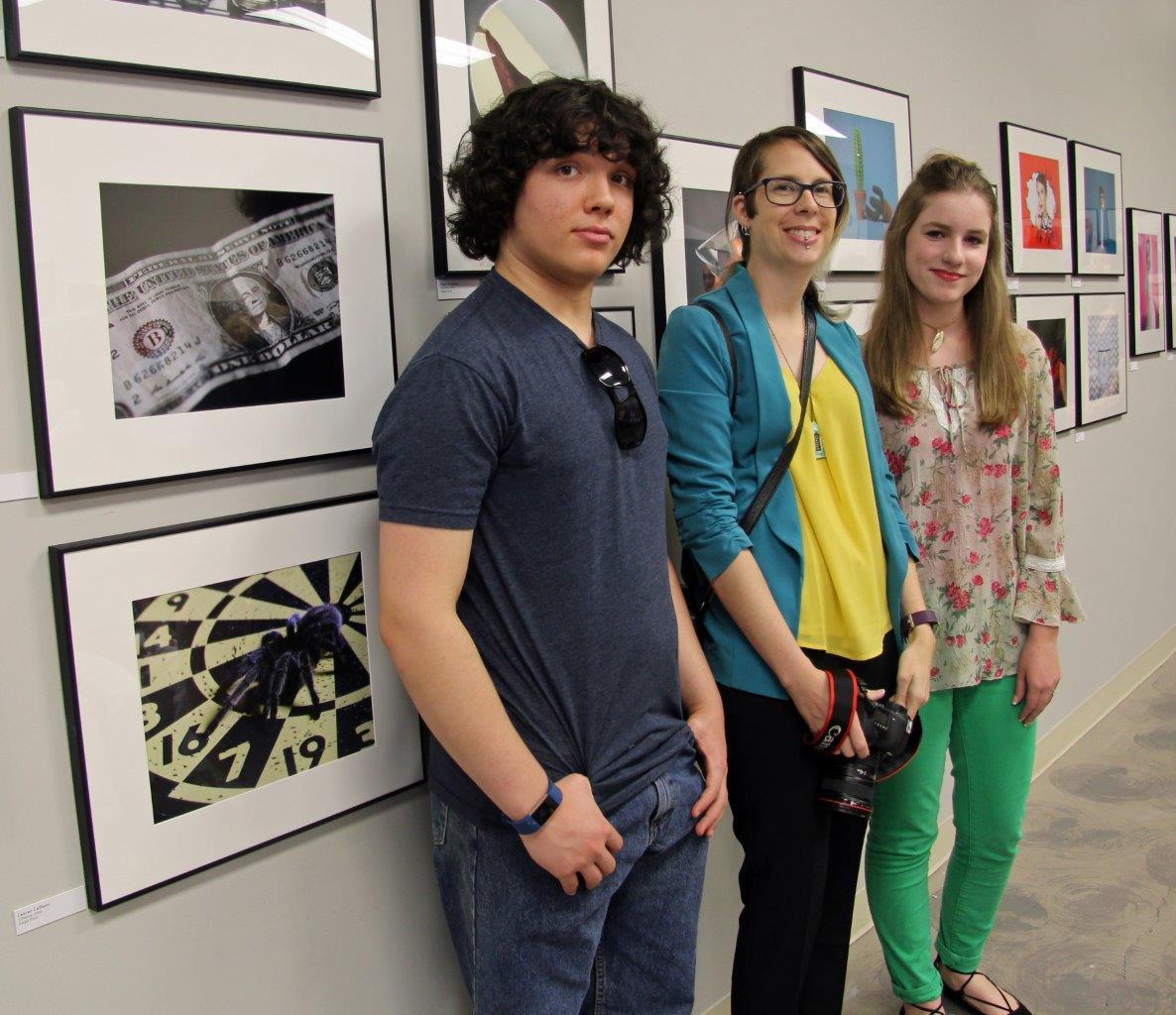 Christina Katsolis (center), SMP programming director, with two of the students in the Southeast Museum of Photography Show,  Connor McCarthy and Brooke Borgardt. Photo courtesy of FCAL