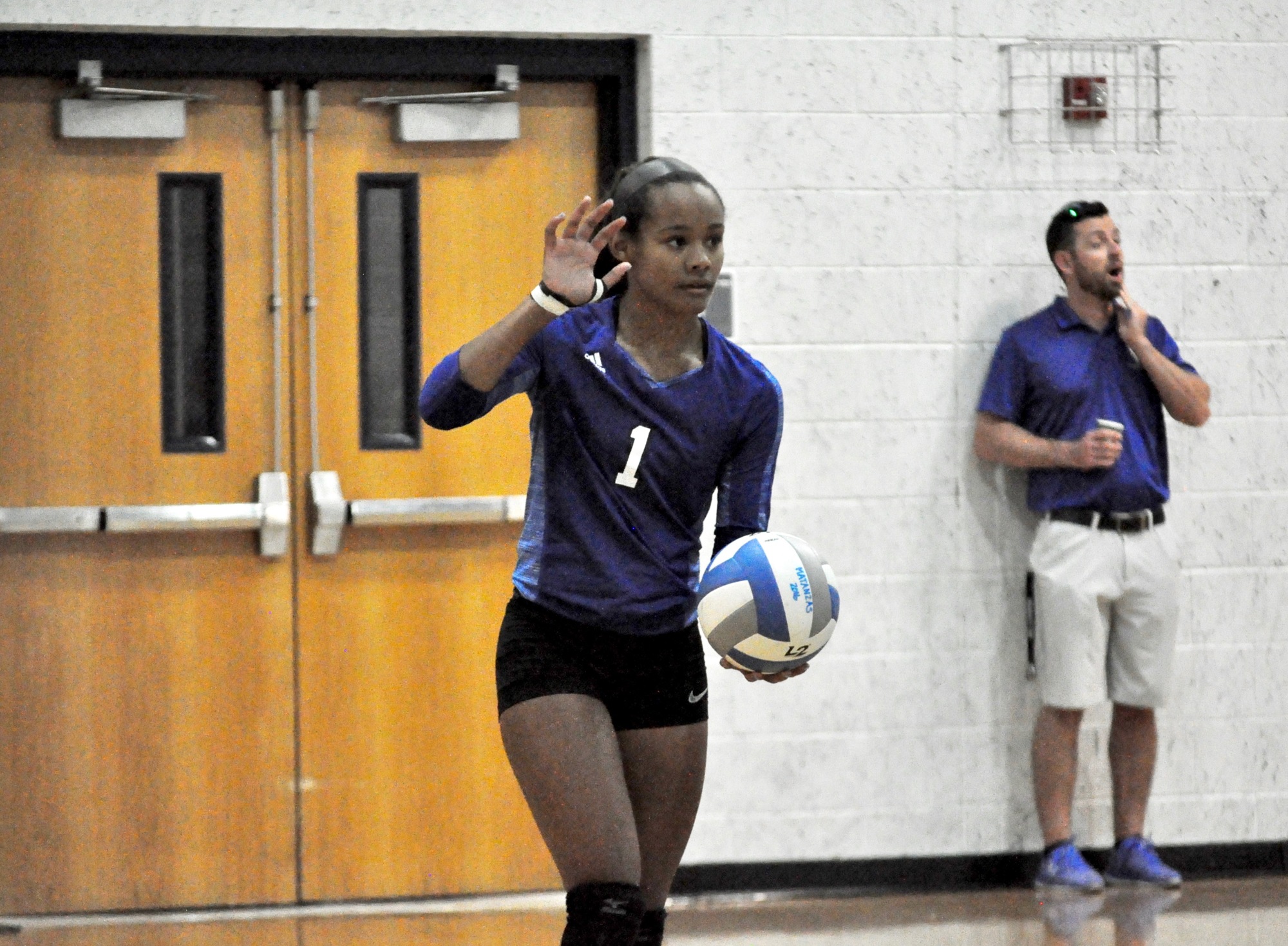 Matanzas outside hitter Jaelyn Lawrence prepares to serve during the first set against Calvary Christian. Photo by Ray Boone