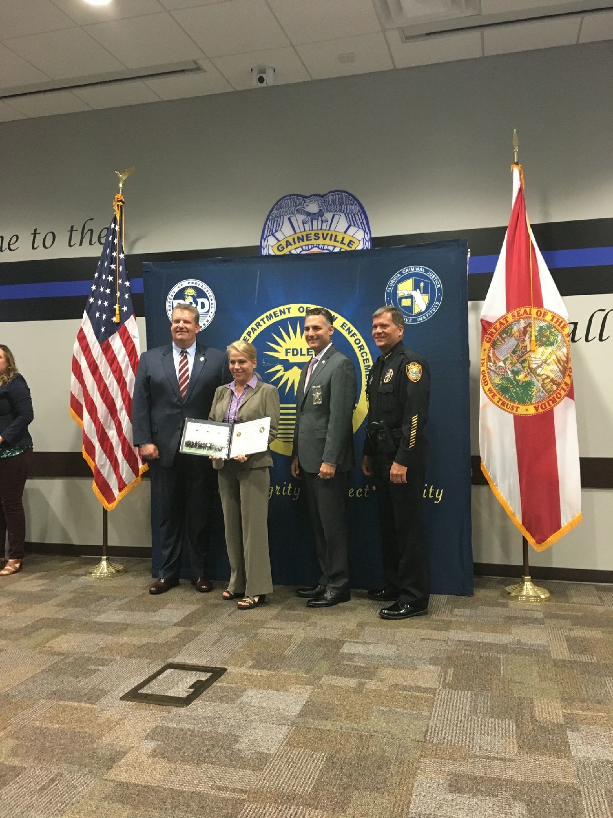 Flagler County Sheriff’s Office Sergeant Jennifer Taylor holds up her graduation certificate from the Florida Leadership Academy. Photo courtesy of FCSO