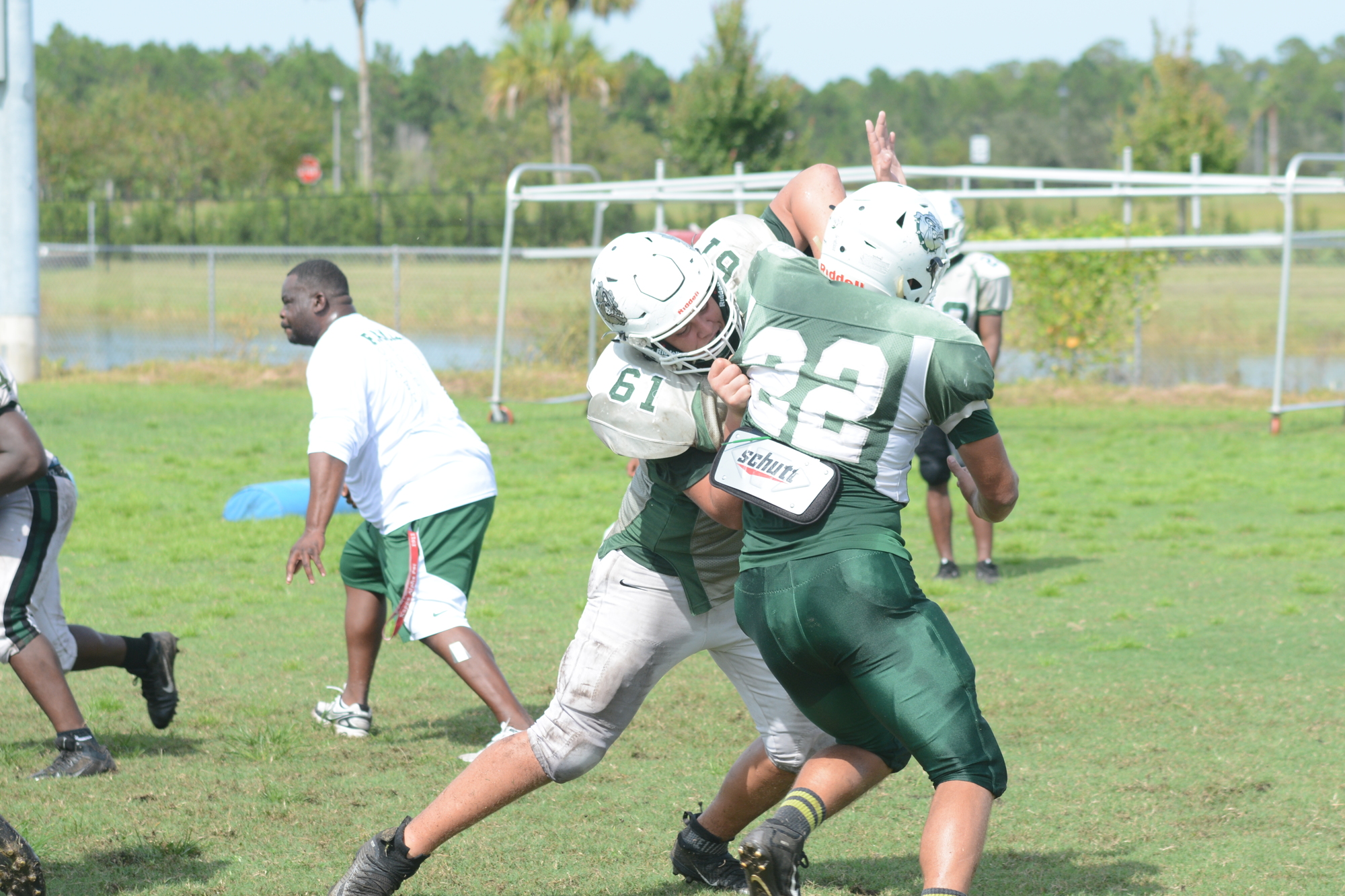 FPC left tackle Verneal Henshaw (No. 61) blocks a defender at practice. Photo by Ray Boone