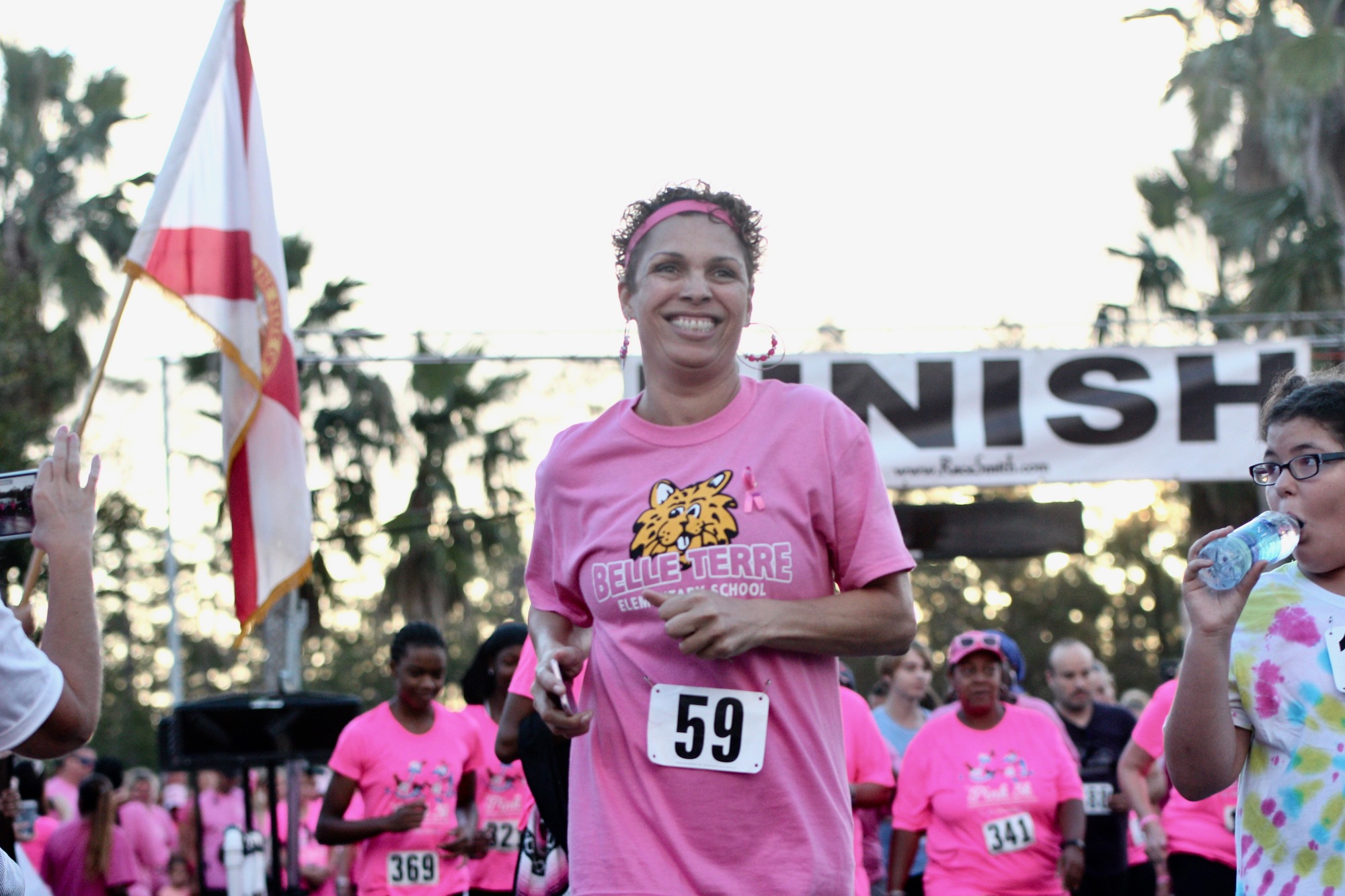 Pink 5K participant Priscilla Campbell smiles as she starts the race at Florida Hospital Flagler. Photo by Ray Boone