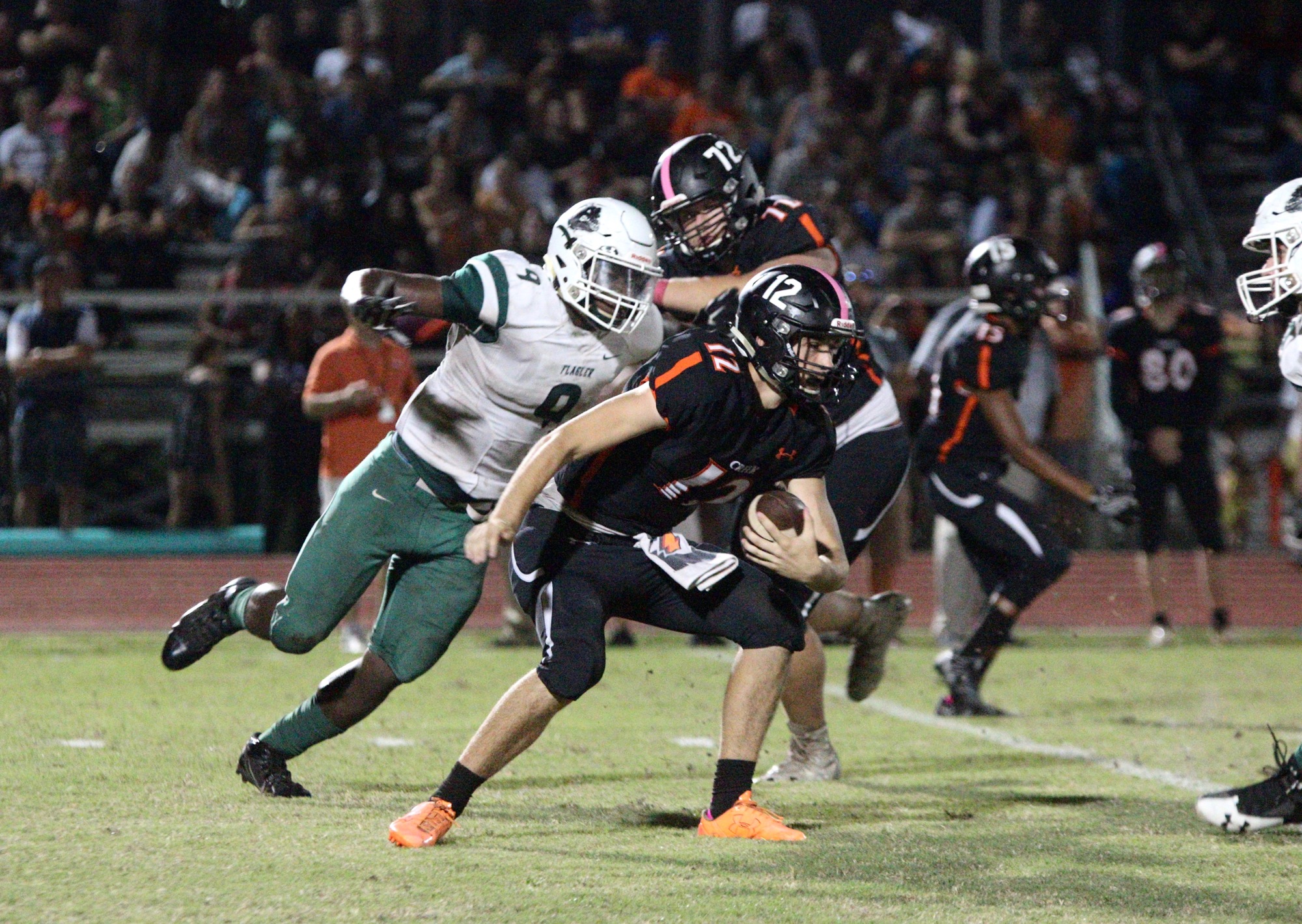 FPC defensive end Nelson Paul attempts to sack Spruce Creek quarterback Kyle Minckler in the fourth quarter. Photo by Ray Boone