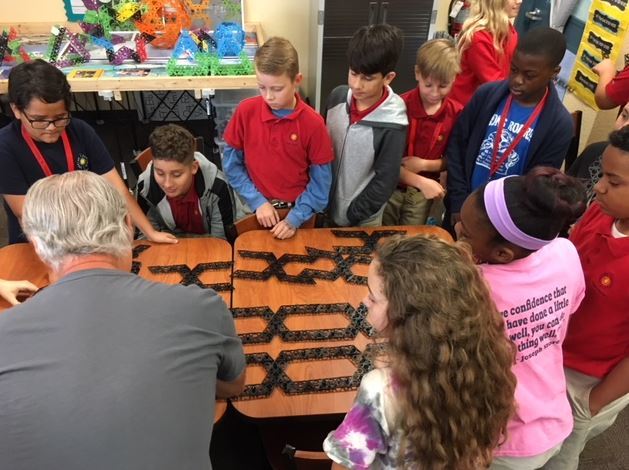 Qubits Toy inventor Mark Burginger interacts with Imagine School at Town Center middle school students. Photo courtesy of Nicole Puritis