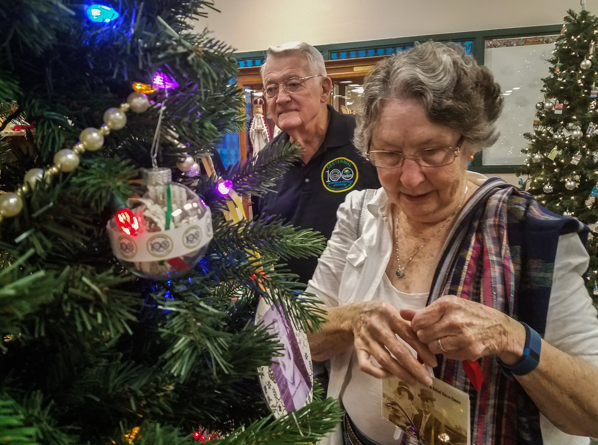 Sisco and Gloria Deen look at the centennial-themed tree. Photo courtesy of Julie Murphy