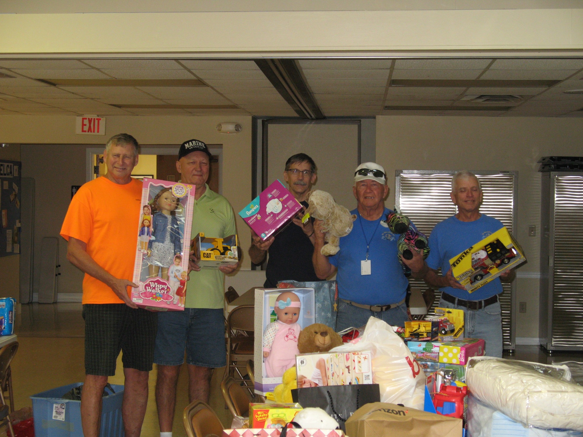 St. Mark by the Sea men's club members Rick Phillips, Ron Gossard, Andrew Clark, Bob Malmquist and Tom Eichen pose with the gifts the congregation donated to Family Life Center. Photo courtesy of Bob Malmquist