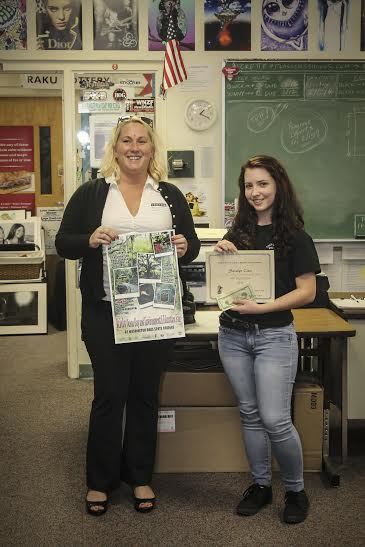 Danielle  Anderso,  from the Friends of A1A, awarded the $100 prize to FPC student Saralyn  Cieri. Courtesy photo