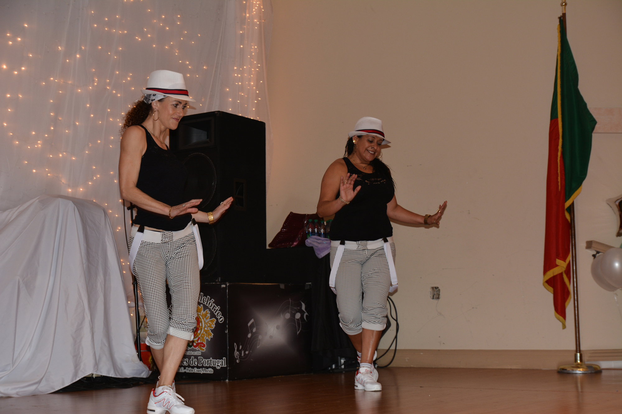 Michaela King and Dalia Irwin teach dance moves to 