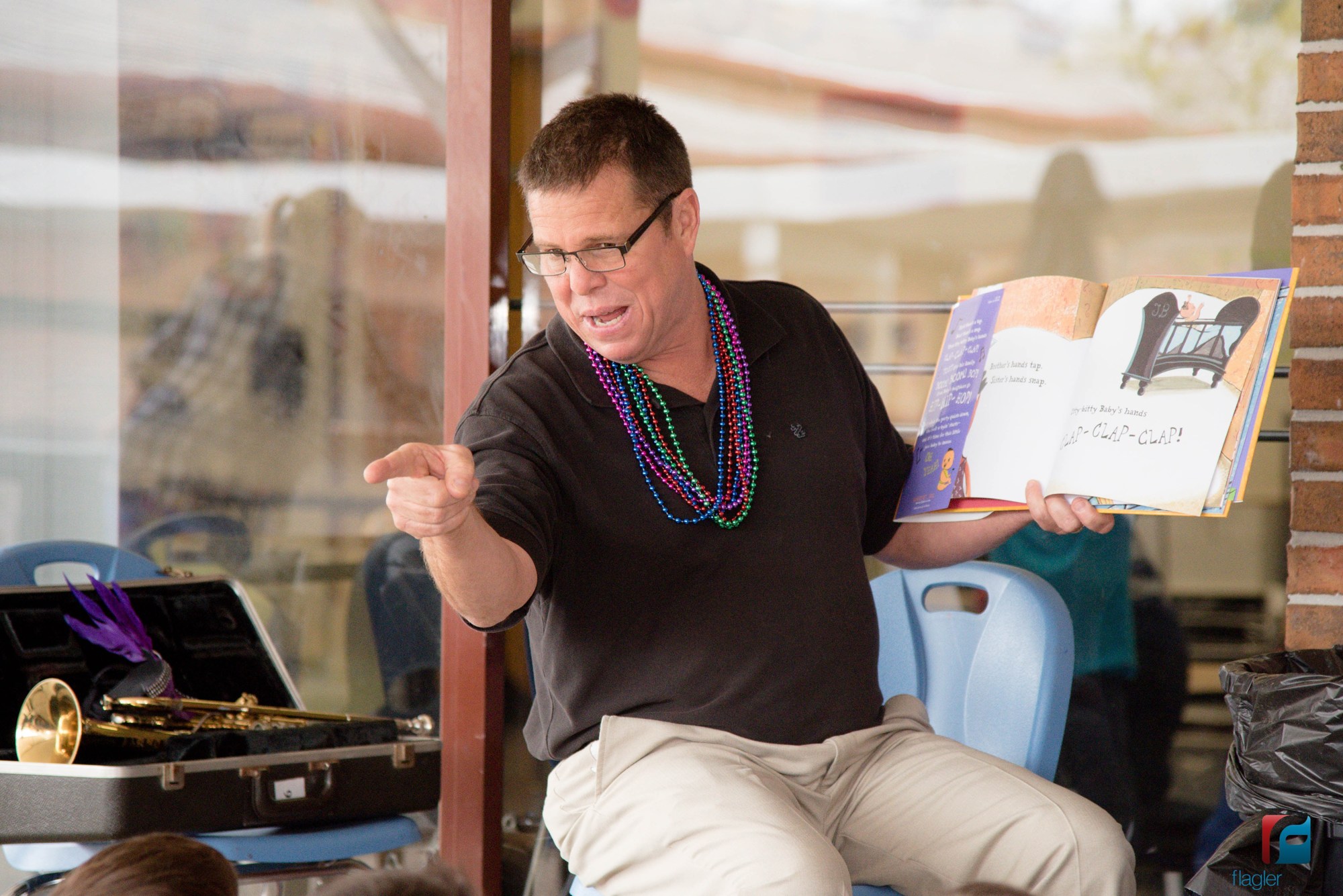 OKES music teacher Rodney Harshbarger reads a Mardi Gras book to students. Courtesy photo by Jason Wheeler
