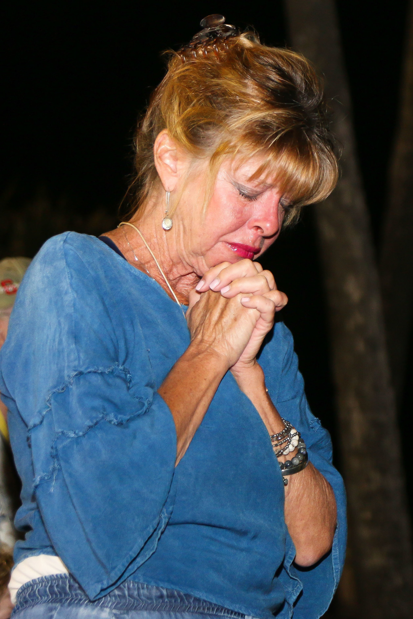 Flagler Beach resident Elizabeth Mailhoit gets emotional during the moment of silence for the 17 victims of the Parkland shooting. Photo by Paige Wilson