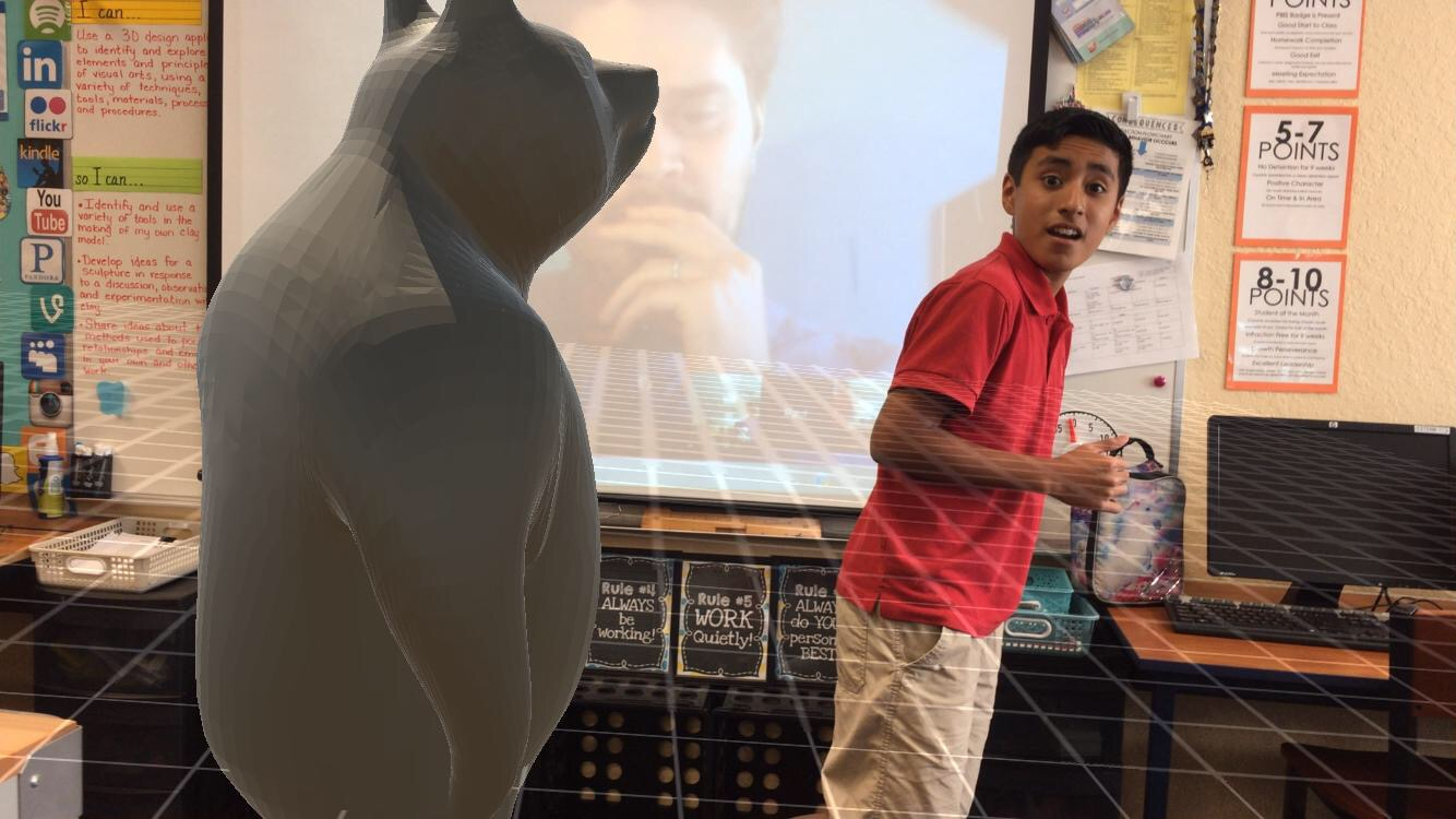 Imagine School at Town Center student Jeremiah D. runs away from a 3D augmented bear. Photo courtesy of Nicole Puritis