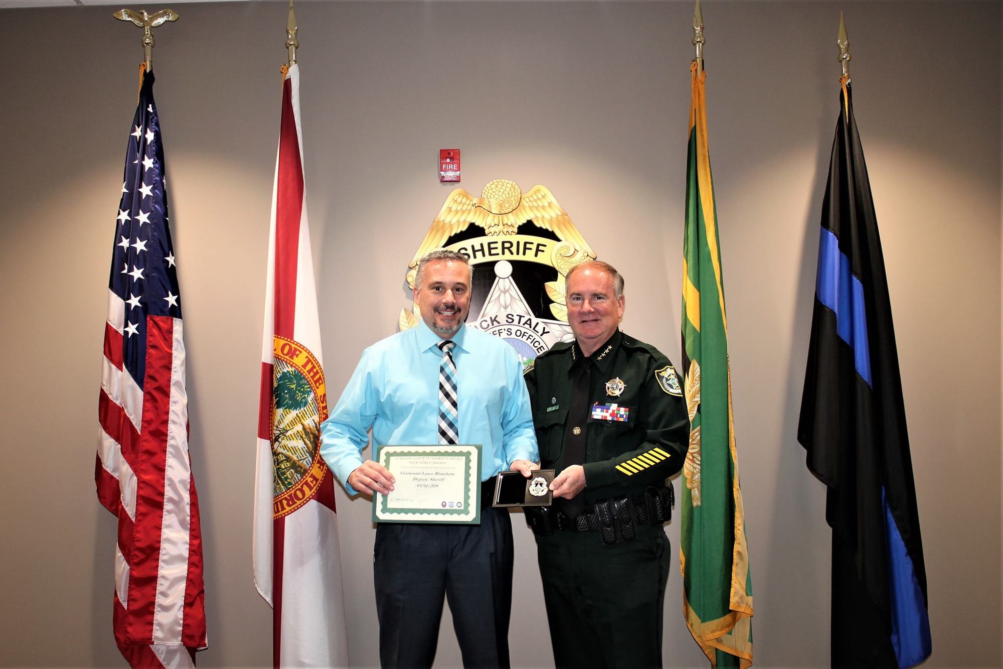 Flagler Beach Police Lt. Lance Blanchette is sworn in as a Flagler County Deputy Sheriff by Sheriff Rick Staly. Photo courtesy of Flagler Beach Police Department Facebook