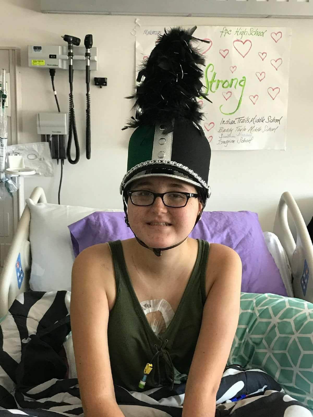 Toniann Mussleman poses with her band hat in the hospital. Photo courtesy of John Koller