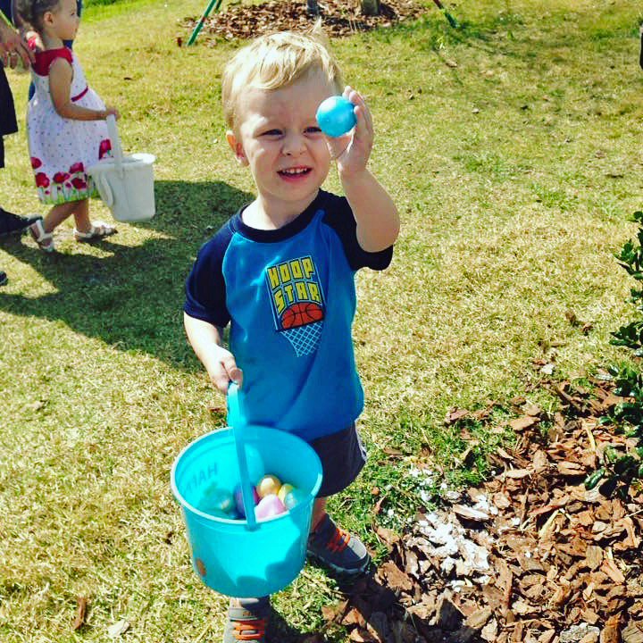 Palm Coast resident Noah Schweers, 2, holds up a blue egg he found at the 2017 Egg’Stravaganza. Photo courtesy Cindi Lane
