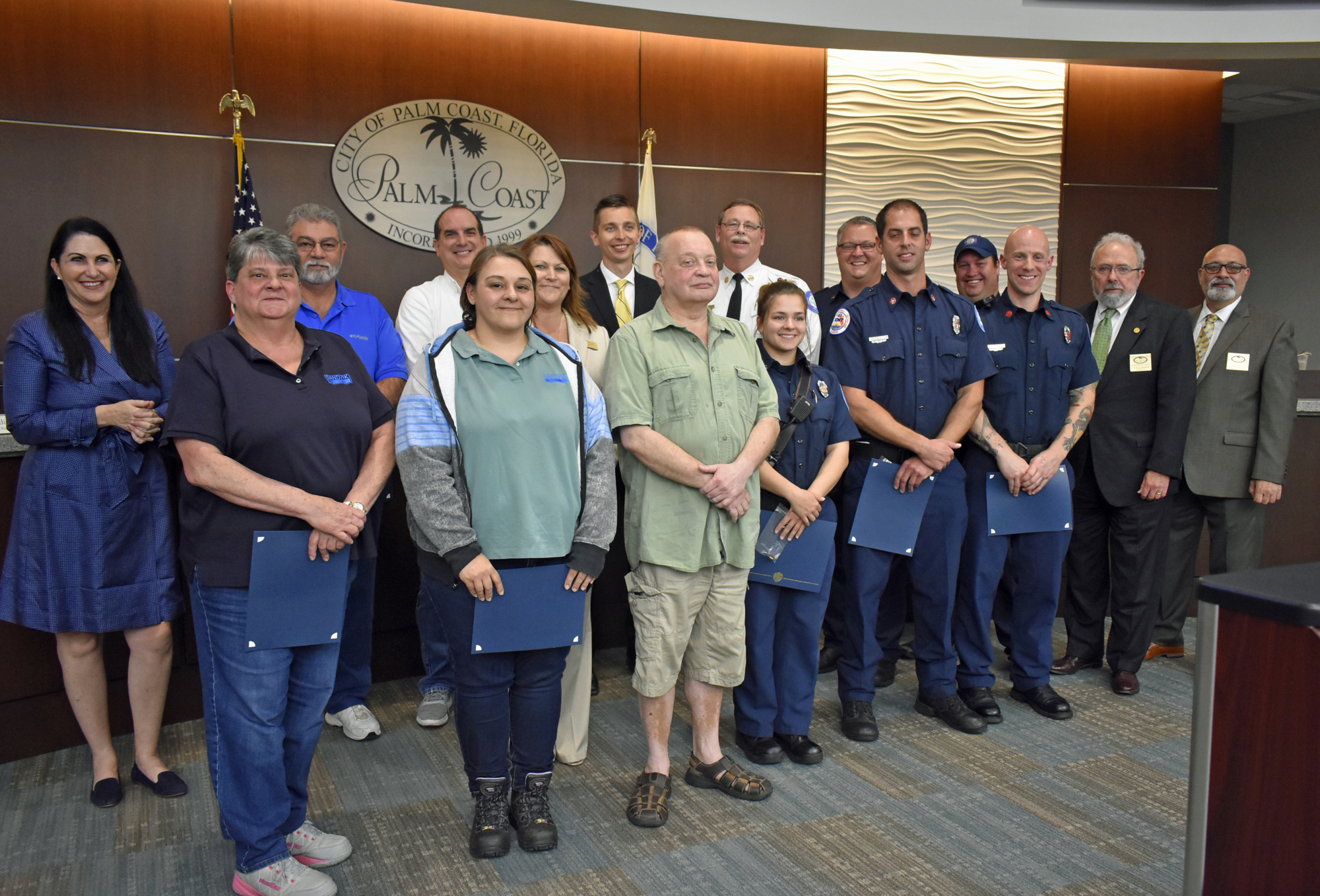 Palm Coast resident Serge Judro, center, attended the Palm Coast City Council meeting April 3 to help honor the Palm Coast Fire Engine 21 crew and Judro’s coworkers for their roles in saving his life. Photo courtesy of Cindi Lane