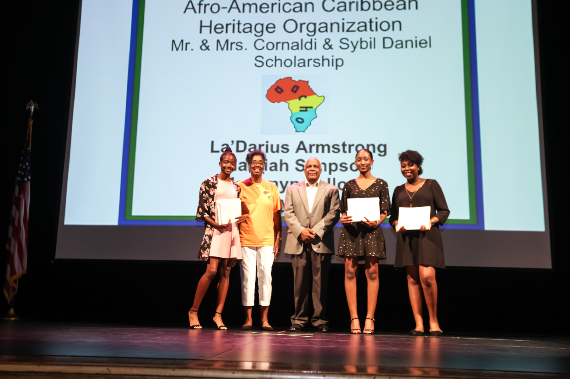 Namiah Simpson, AACHO President Vivian Richardson, Scholarship Committee Member Donald Maxwell, Jazzmyn Falloon and Emany Desinor.  (Not pictured is the fourth recipient, La'Darious Armstrong.)  Courtesy photo