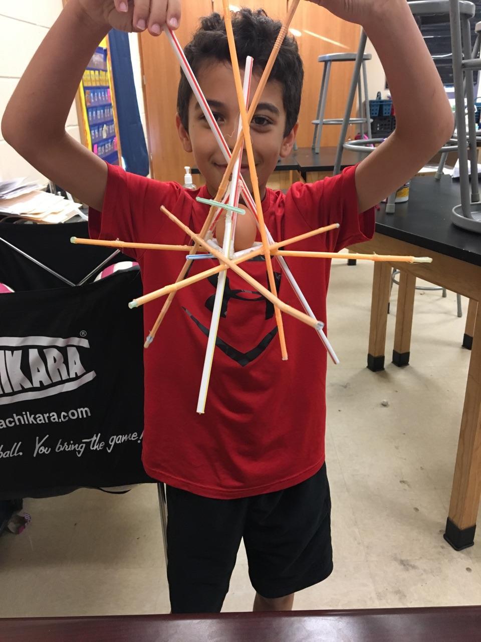 Imagine School at Town Center student Jack Gallagher shows off his egg drop creation. Photo courtesy of LaToya Taite-Headspeth
