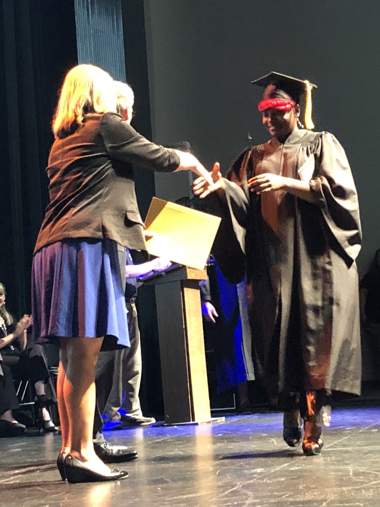 Chantal Johnson walks across the stage at the Flagler Technical Institute graduation. Photo courtesy of Sharon Kochenour