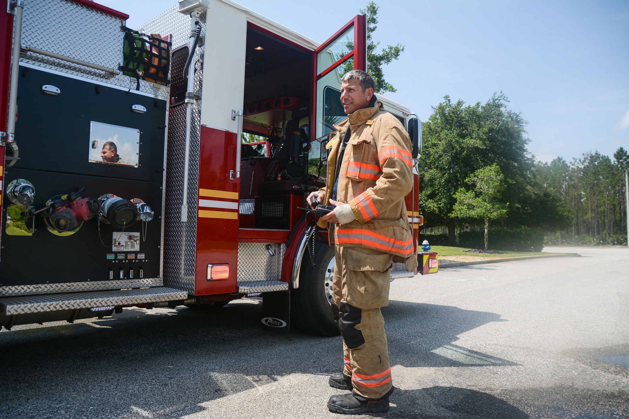 Lt. Jason Wagner exits Fire Engine 23 after returning to the station when a call for a fire alarm was cancelled mid-route. Photo by Paige Wilson