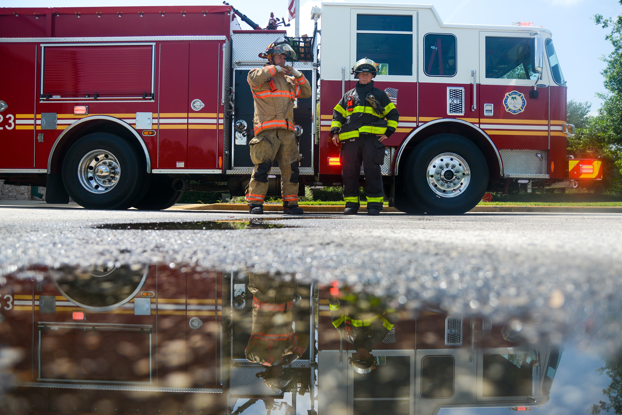 Lt. Jason Wagner and firefighter-paramedic Robert Ballou stand by Fire Engine 23. The duo has been partnered together for over five years with the department. Photo by Paige Wilson