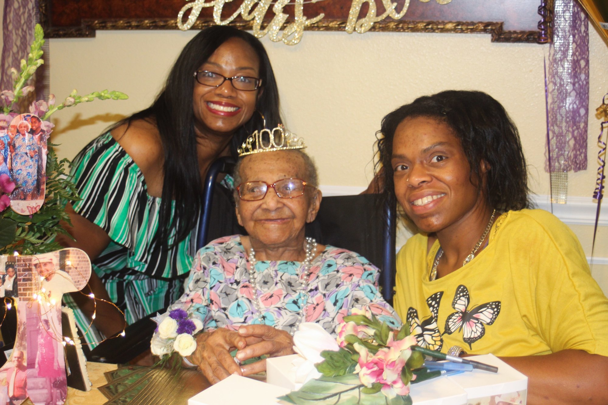 Marjorie Violet Graham (middle) celebrates her 100th birthday with two of her granddaughters, Najah Adams and Tamara Gibson-Alonso. Photo courtesy of Sandra Golden