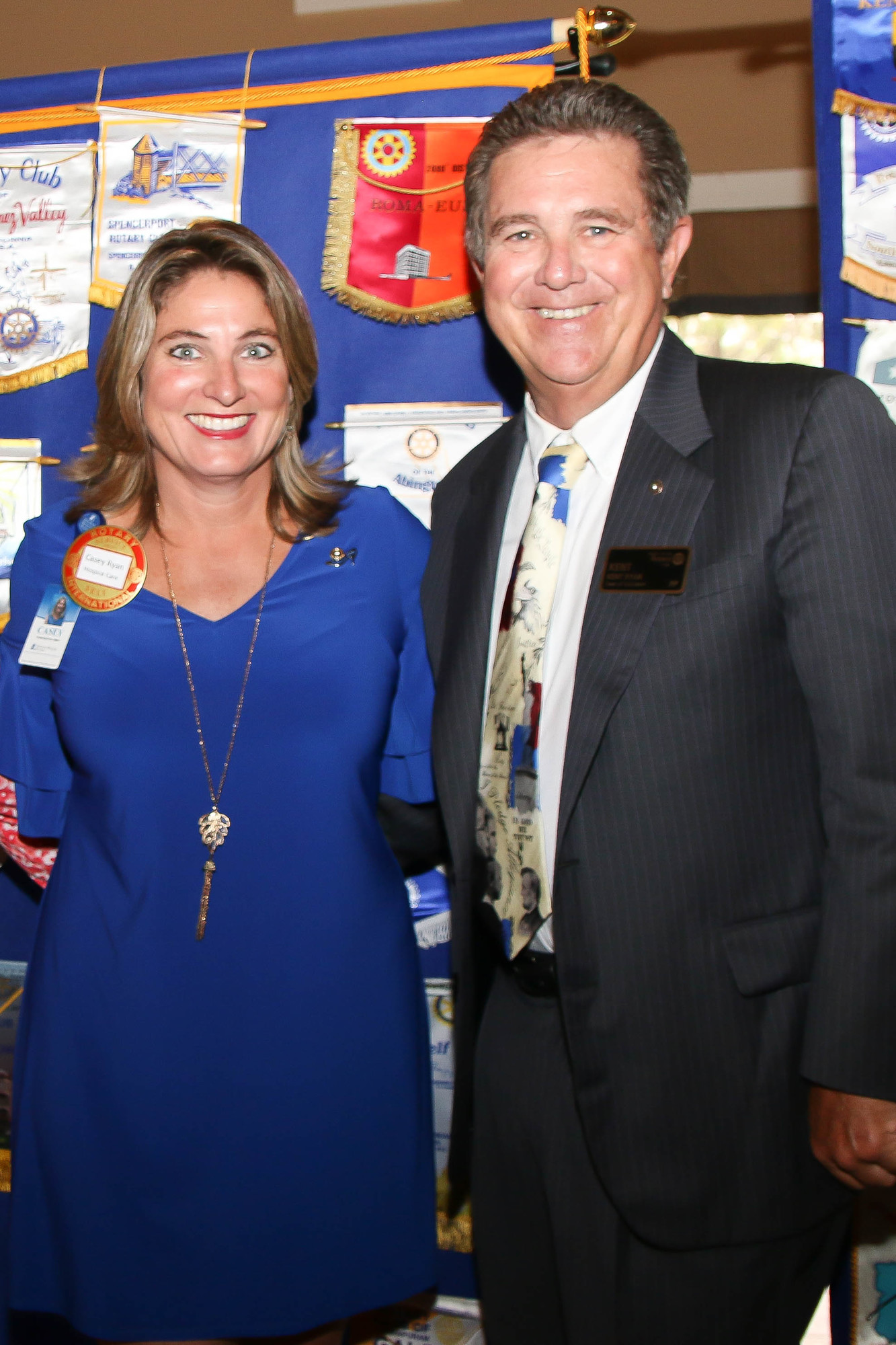 Casey Ryan poses with her father, Kent Ryan, after he inducts her into the Rotary Club of Flagler County, which he was president of from 1993 to 1994. Photo by Paige Wilson