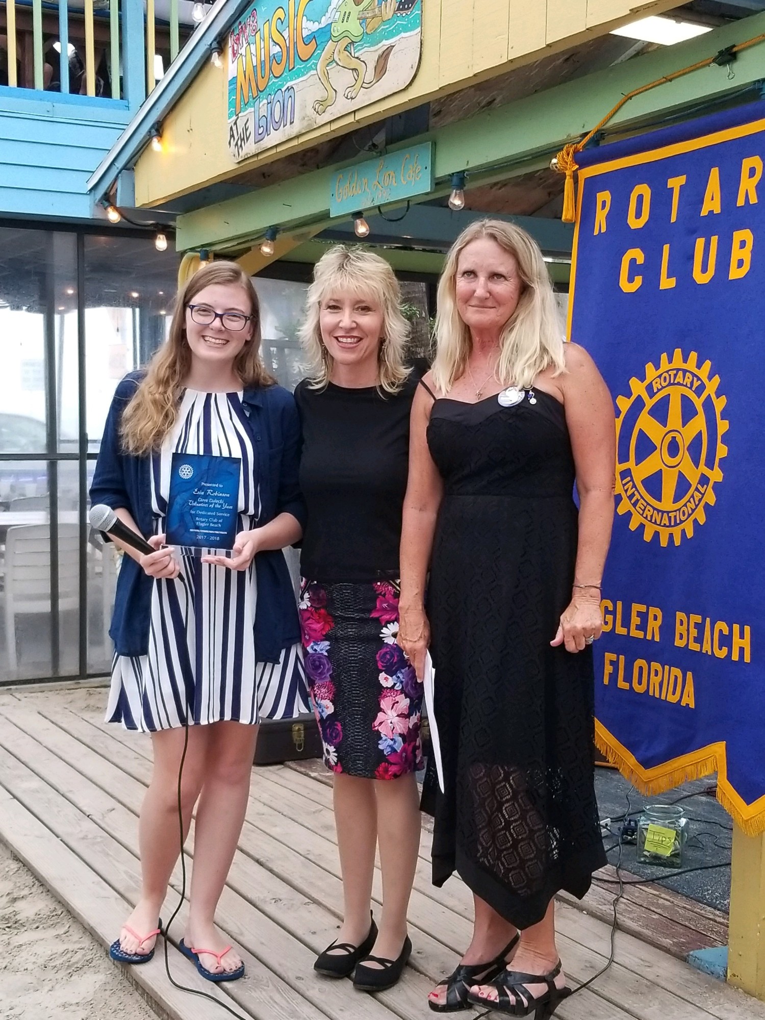 Amanda Bailey and Cindy Dalecki present the First Annual Dave Dalecki Volunteer of the Year award to Erin Robinson. Photo courtesy of Marketing 2 Go