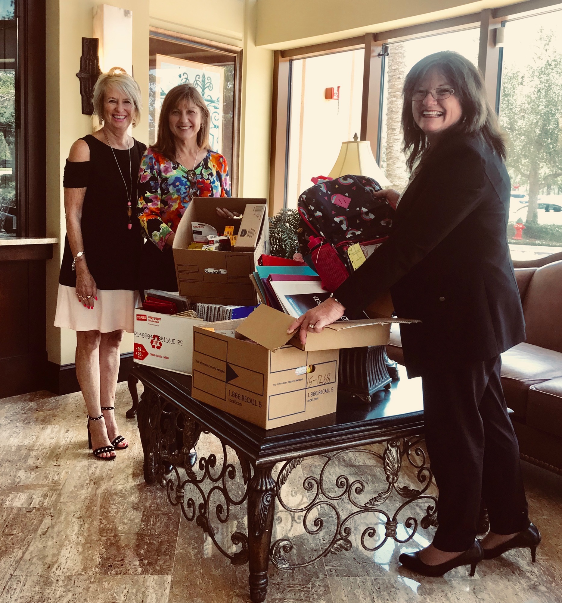 Food Brings Hope Executive Director Judi Winch, Market President Support office’s Maritza Armijos and Senior Vice President and Market Manager Karen Jacob with the school supplies Bank of America donated. Photo courtesy of FBH