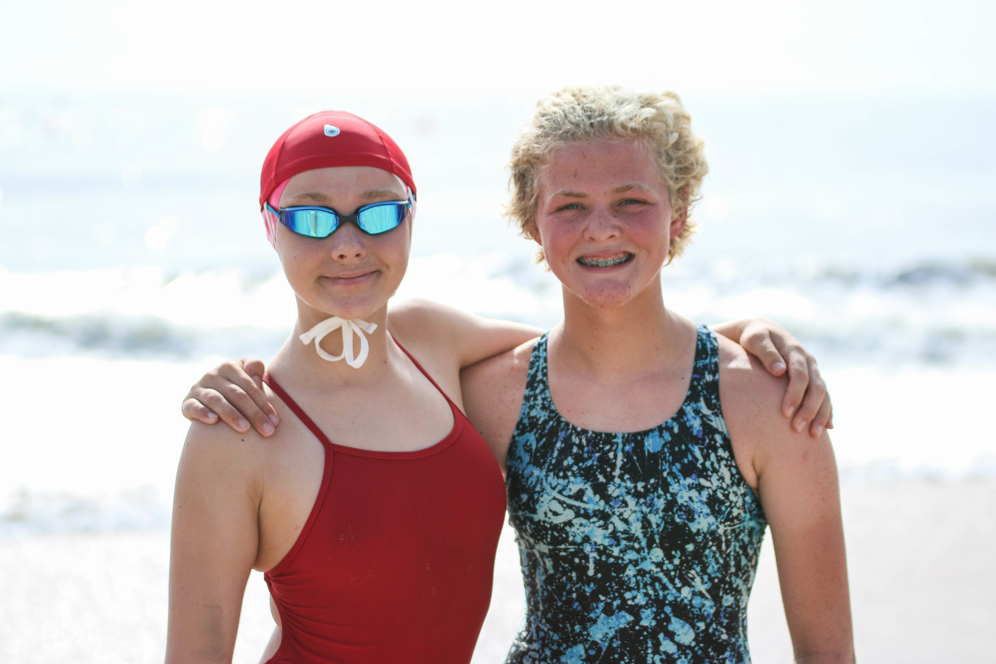 Mia Nilsen, 12, and Lucy Noble, 13, pose at the USLA Southeast Regional Championship, representing Flagler Beach lifeguards. Photo by Paige Wilson