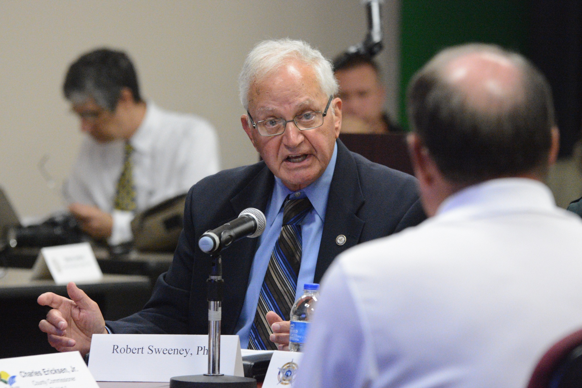Robert Sweeney presents his findings to the County Commission (Photo by Jonathan Simmons)