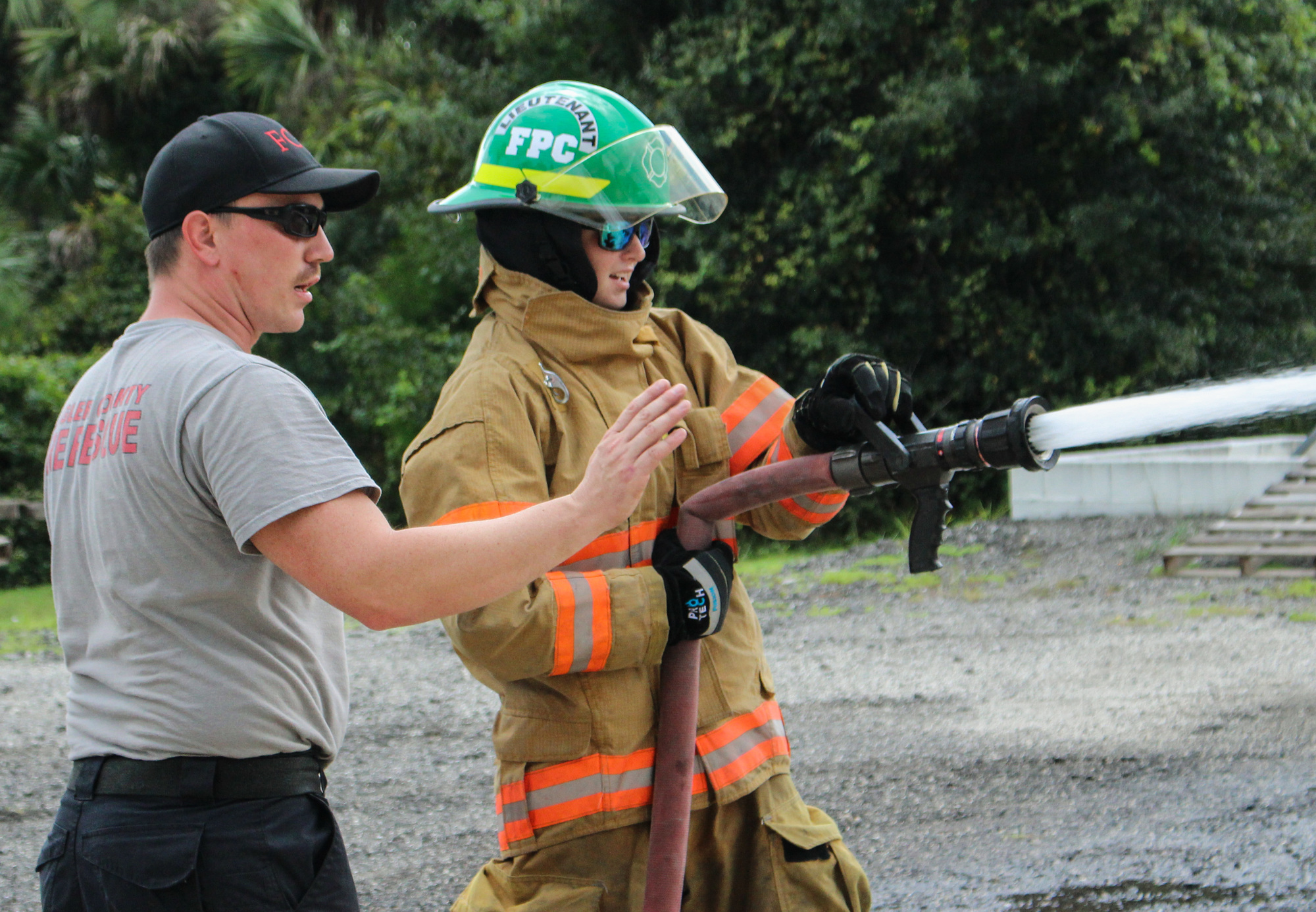 Fire instructor Kyle Najpaver and FPC student Sydney Adams. Photo courtesy of Flagler County
