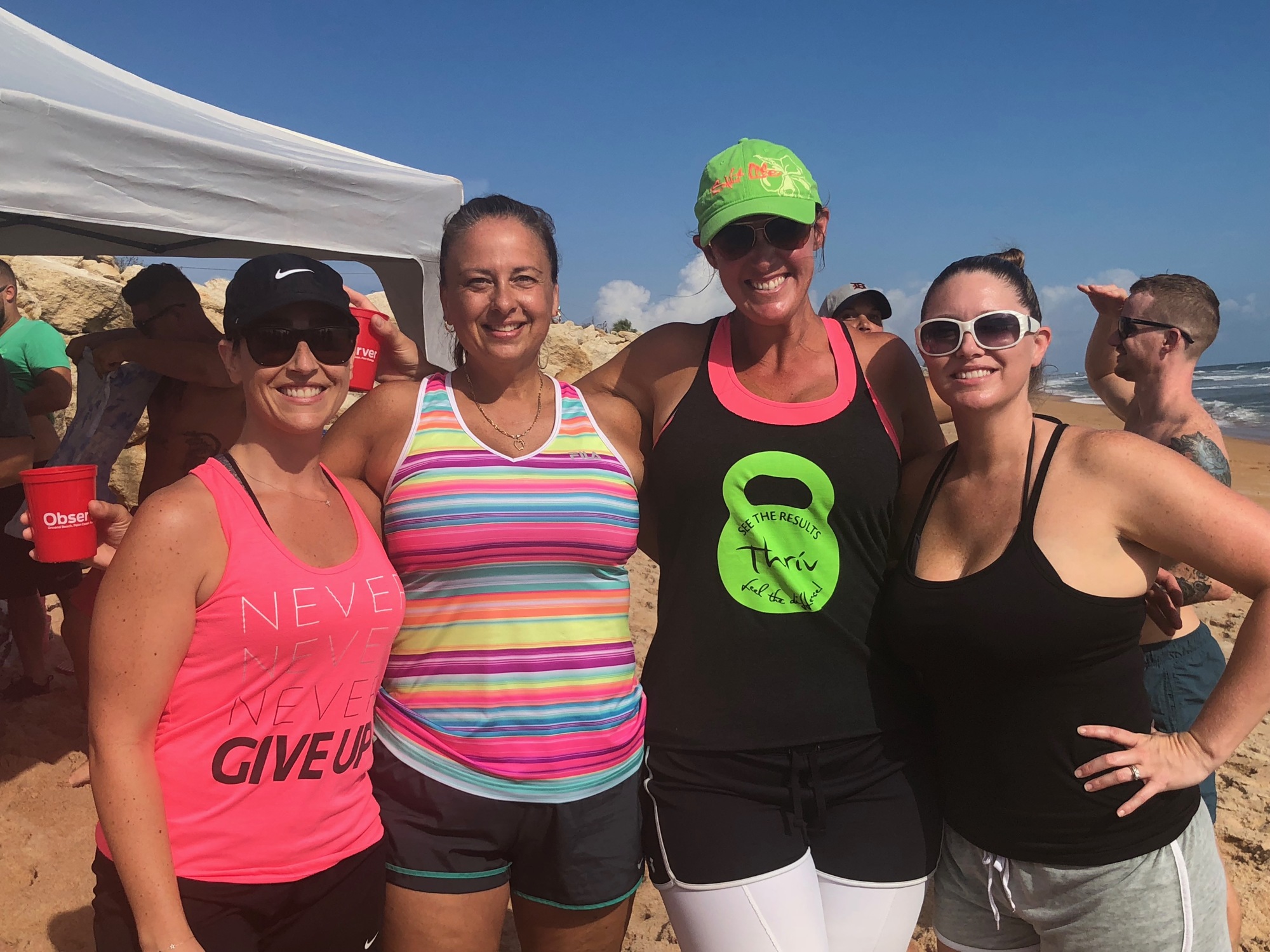 Christine Gaspar, Ashley DeMaio, Hilary O’Boyle and Traci Lavino were the winning team at the YPG Beach Olympics. Photo courtesy of Hallie Hydrick