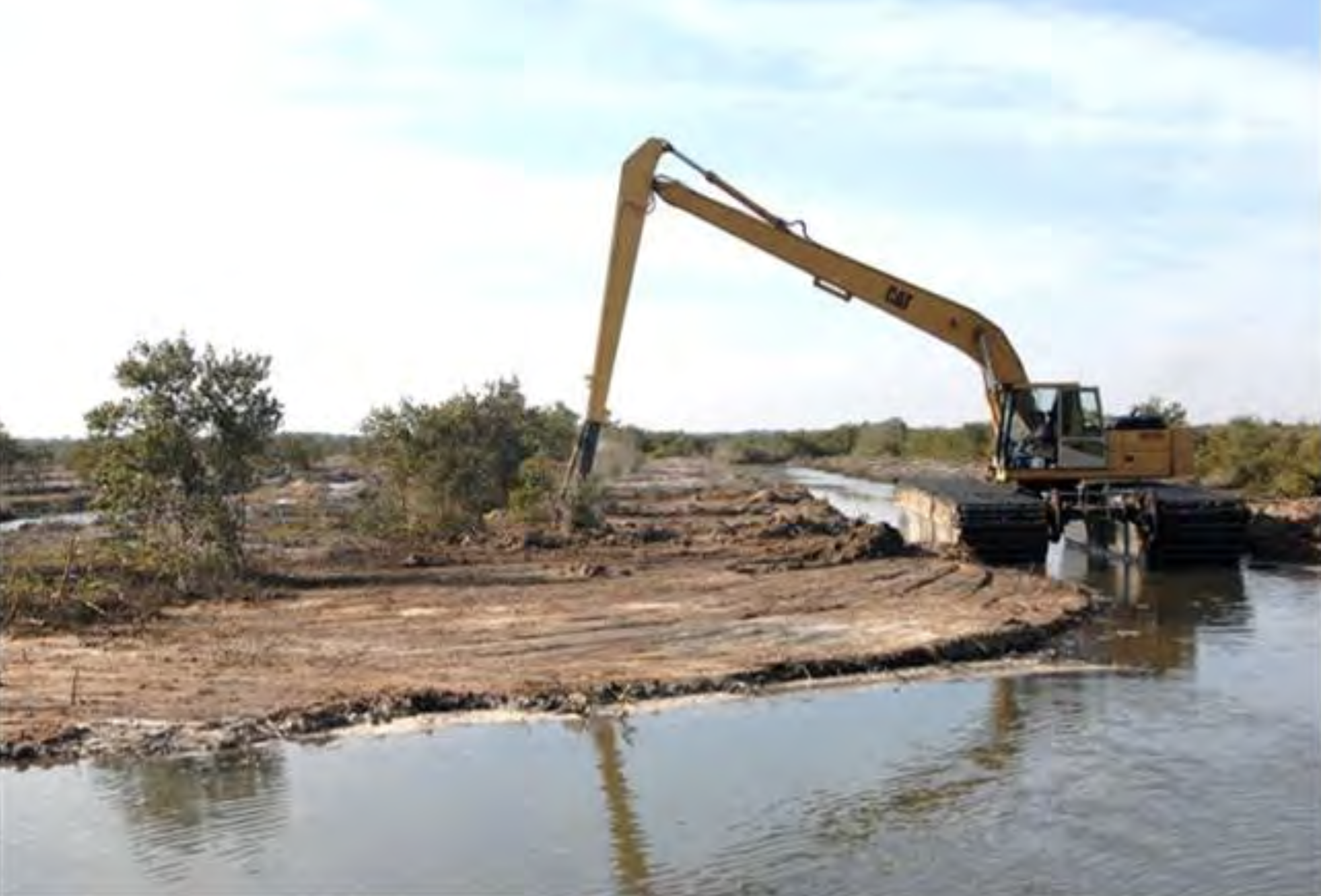 Locals have said they're concerned about the use of heavy equipment — as shown here from a  wetland restoration project elsewhere — in the marsh. (Image from County Commission workshop backup documentation)