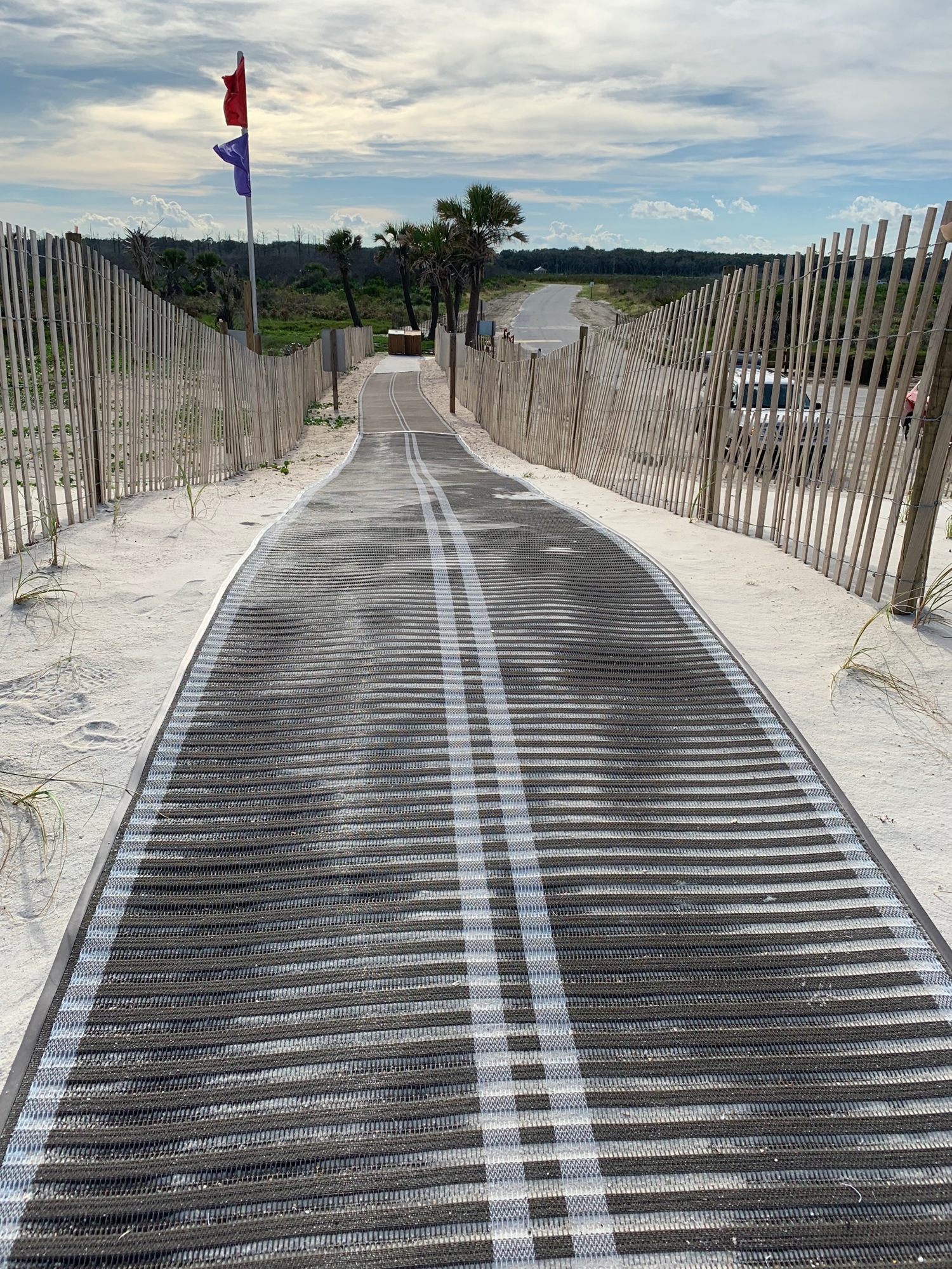 Mobi-Mats provide a low-impact path over the dunes, instead of a wooden structure.