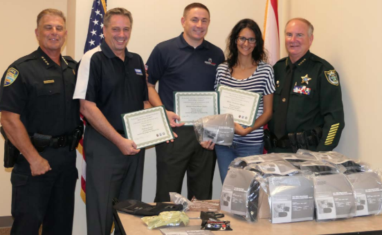 Bunnell Police Chief Tom Foster, Tom Heiser with Coldwell Banker, Sam and Maria Royer with  Heroes First Home Loans, and Sheriff Rick Staly. Photo courtesy of the Flagler County Sheriff's Office