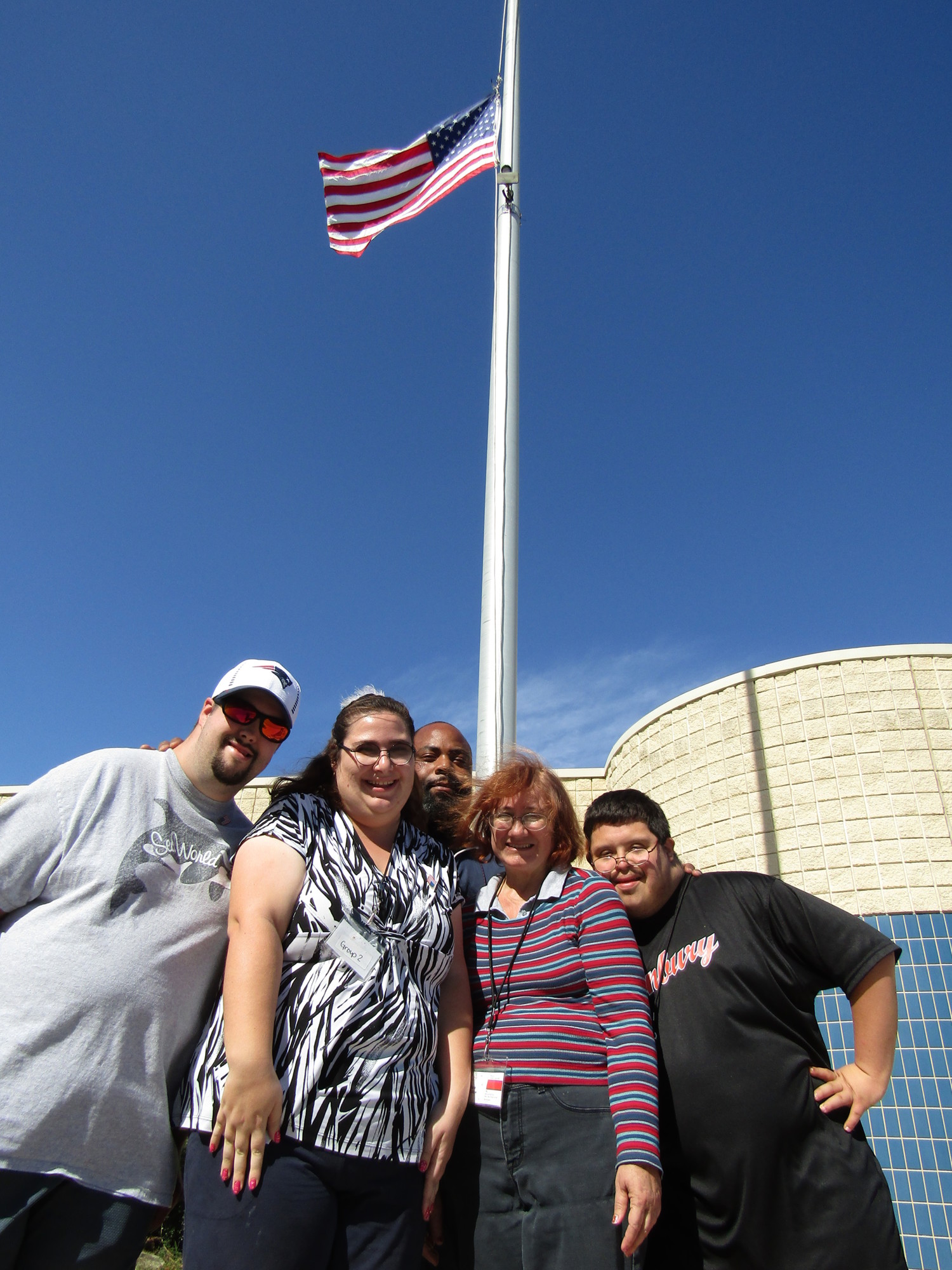 Flagler Technical Institute Ed Specialist David Evans (middle) stands with students Ethan Ward, Kristy Wilson, Diane Outlaw and Jonathan Vegerano, from the Step Up program, who make up the flag-raising team. Photo courtesy of FTI