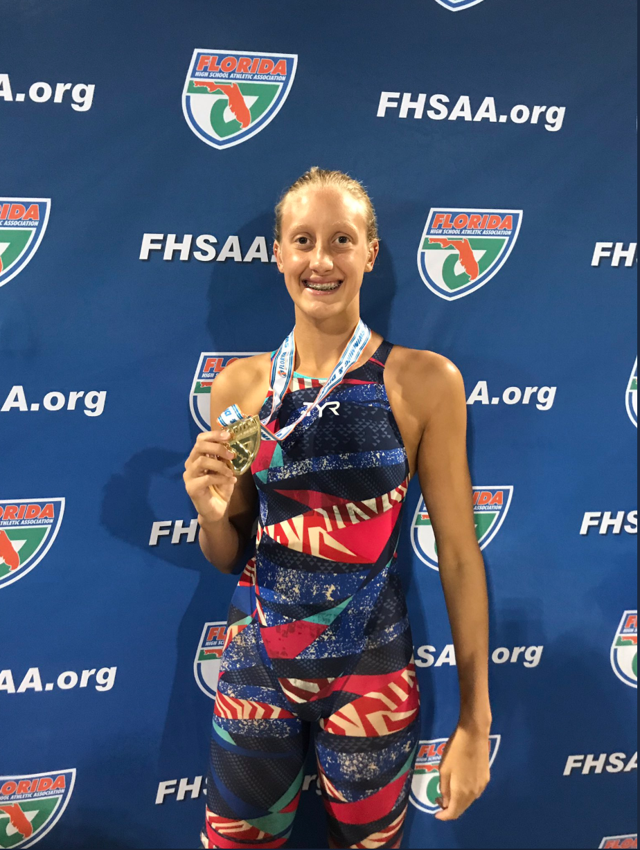 FPC's Micayla Cronk poses with her medal after winning the 100-yard freestyle and 200-yard freestyle. Courtesy photo