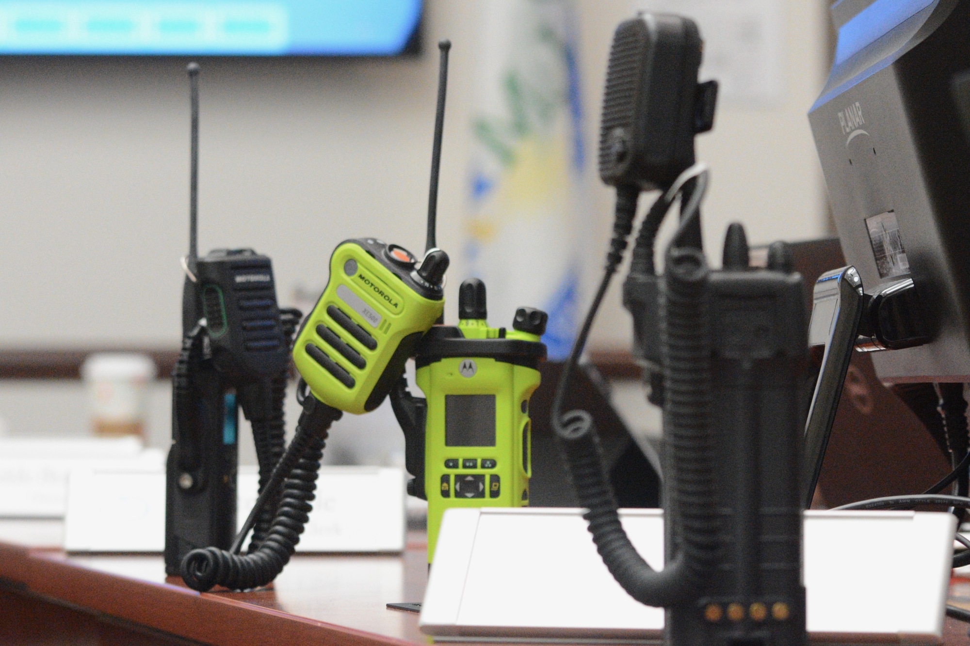 Handheld units for the new radio system. The units, made by Motorola, will have GPS tracking and will be waterproof. The lime ones designed for fire rescue will be intrinsically safe. (Photo by Jonathan Simmons)
