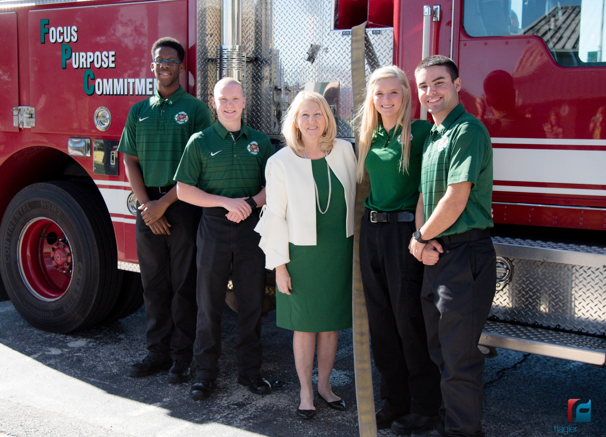 Florida Education Commissioner Pam Stewart  poses with some of the Flagler Palm Coast High School fire academy students. Photo courtesy of Flagler Schools