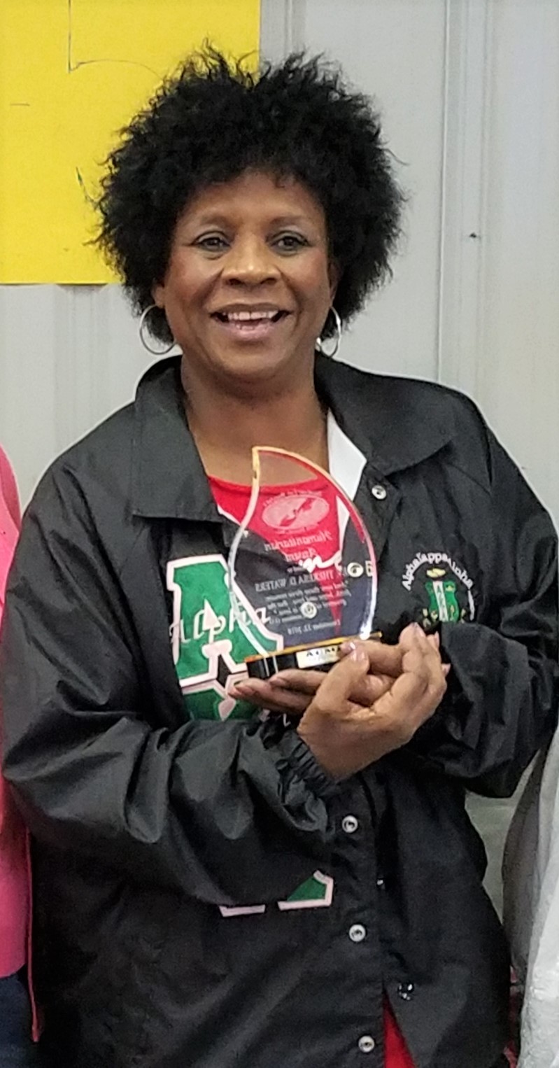 Rev. Theresa Waters poses with the 2018 Humanitarian Award, which was sponsored by ponsored by Community Partnership for Children Inc. and Abundant Life Ministries Inc. Photo courtesy of Myra Valentine