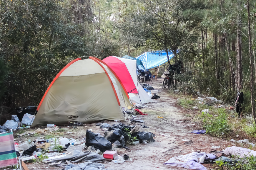 The homeless camp behind the Flagler County Public Library is covered in trash and human waste, creating a hazard to the public. Photo by Ray Boone