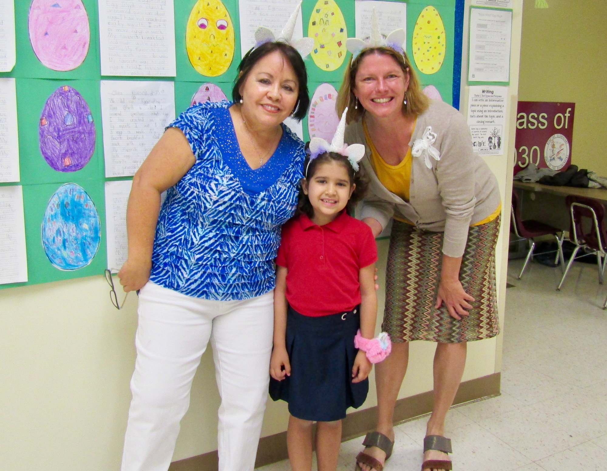Nitza Roman and Melanie Tahan with first-grader Sophia Costa at the check presentation party. Courtesy photo