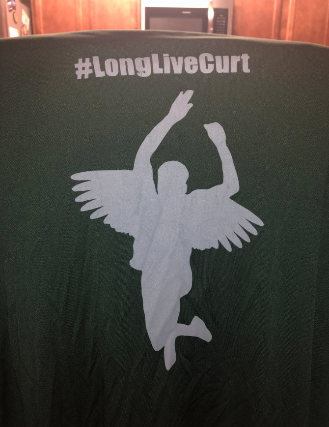 A silhouette of Curtis Gray jumping with angel wings and a halo. The shirt costs $20, and the profits will go to a scholarship in Gray's honor. Courtesy photo 