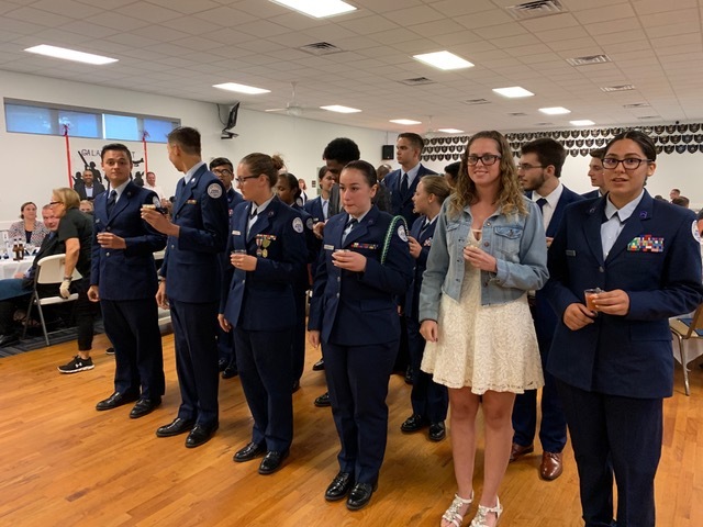 The Air Force JROTC graduating senior class partake in a grog bowl tradition. Photo courtesy of James E. Boyd